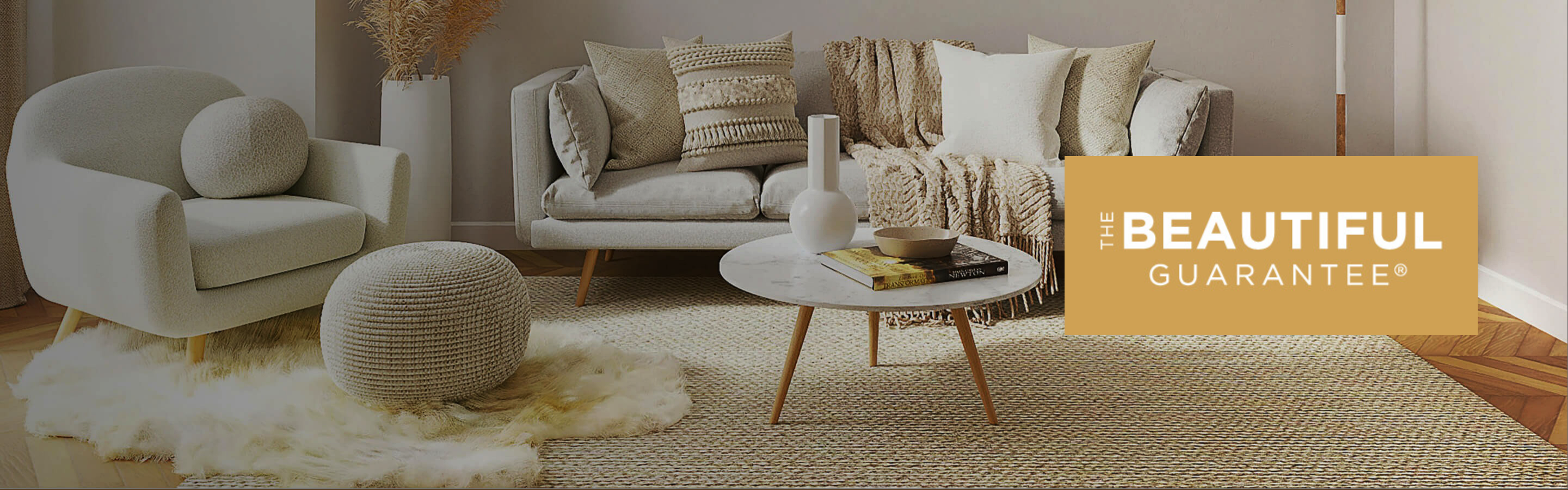 Light colored area rug and luxury vinyl flooring in living room