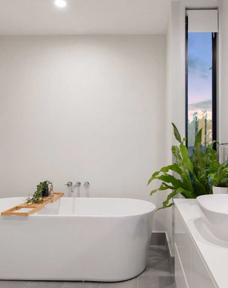 Bathroom featuring elegant tile flooring in neutral tones